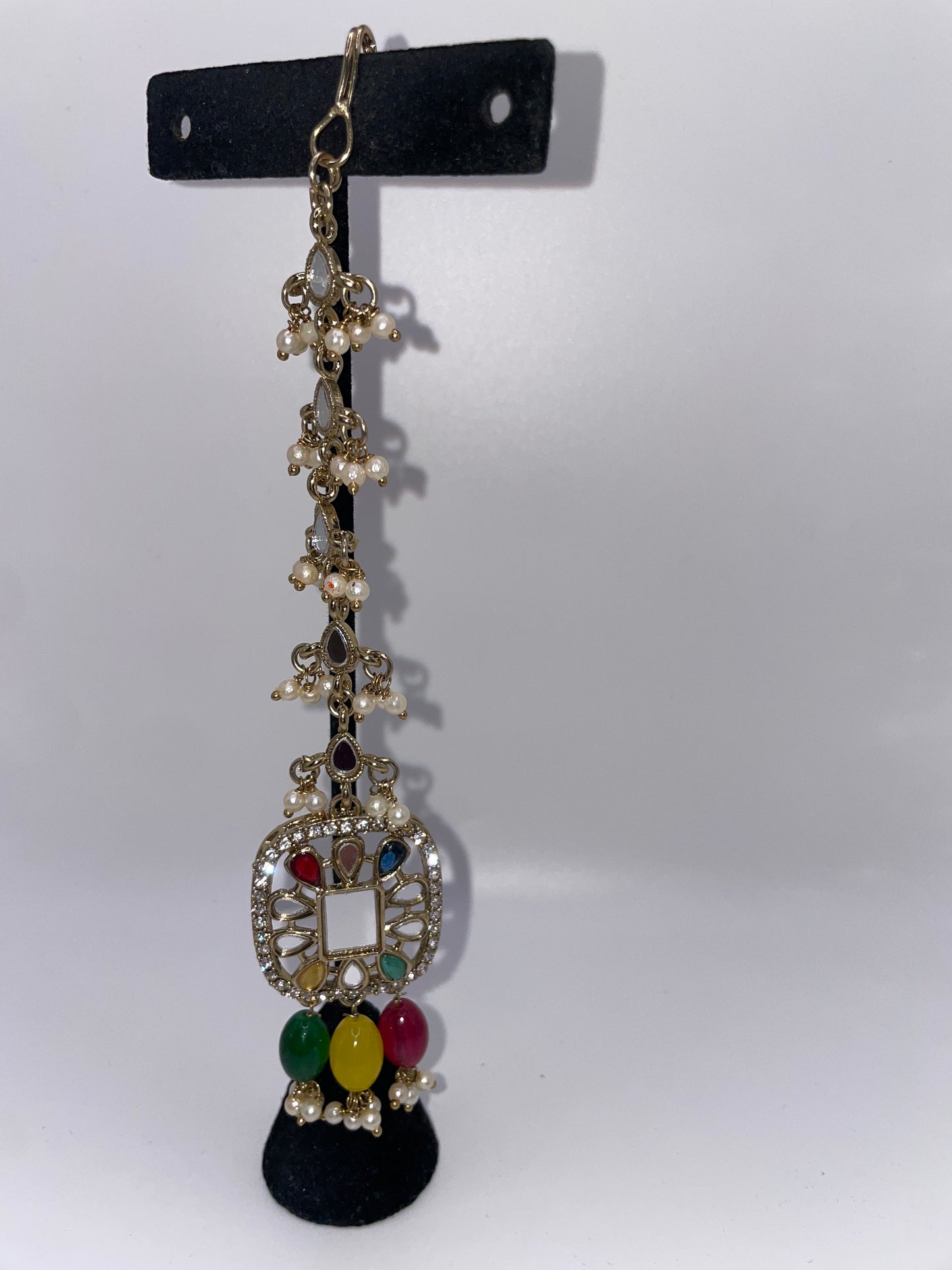 Earrings with earrings chains and tikko