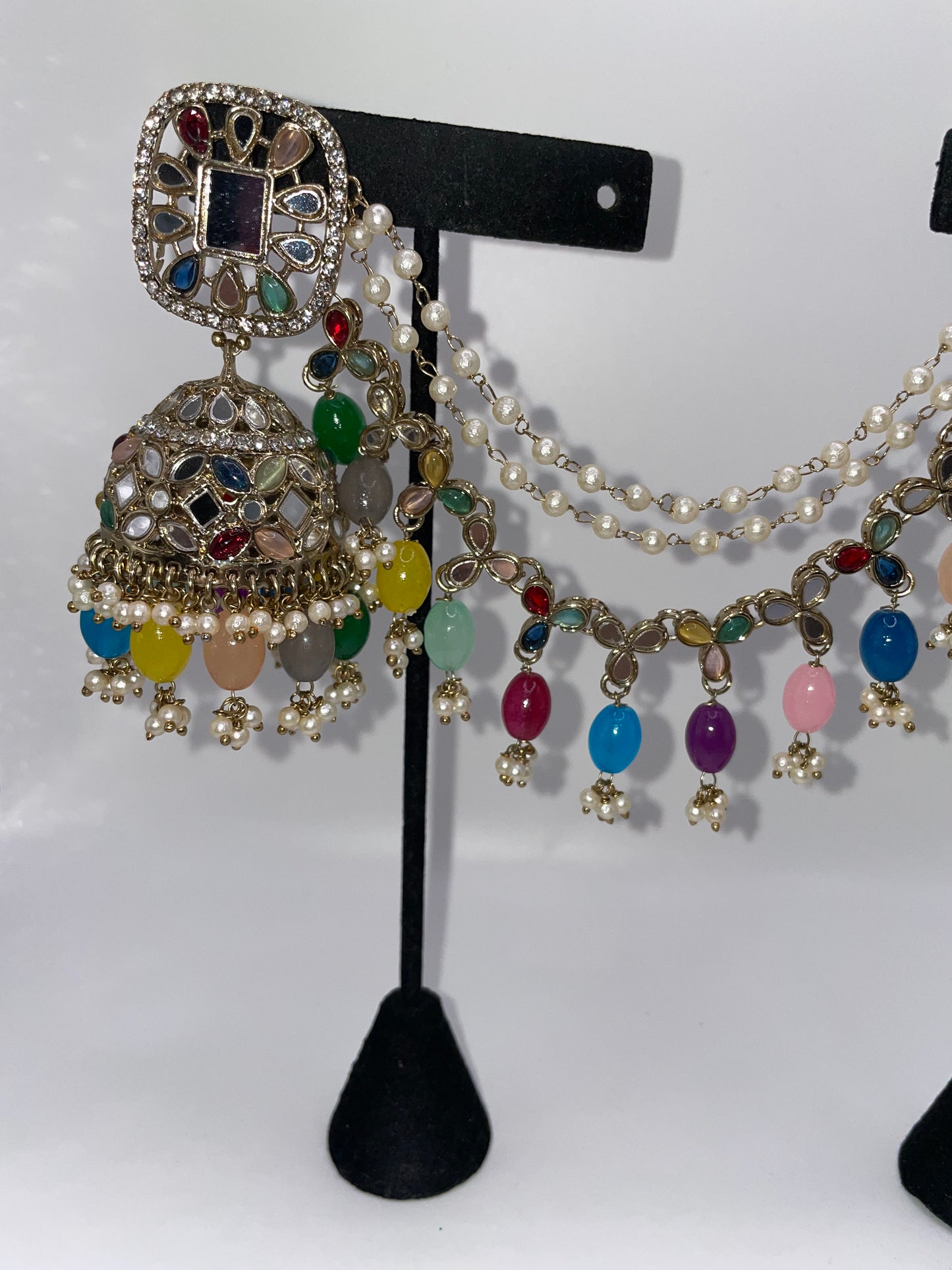 Earrings with earrings chains and tikko